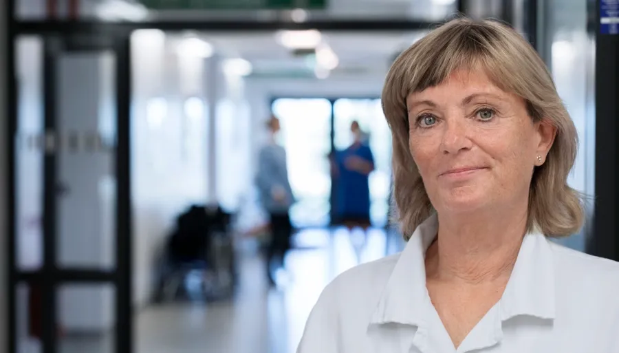 Portrait photo of Anna, an HPC. Transanal irrigation (TAI)  involves passing water into the bowel to enable faeces in the rectum and descending colon to be evacuated. 