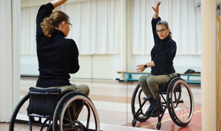 Photo of Marianne in her dance studio. Marianne has discovered wheelchair dancing, and she performs dances like the rumba, paso doble and the chachacha together with her dancing partner. 