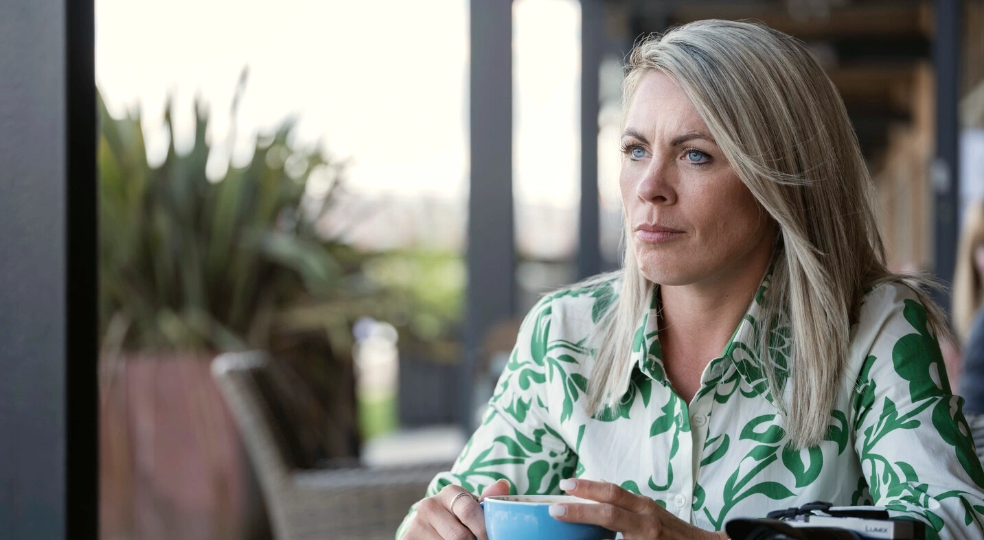 Portrait photo of Laura sitting at a take with a coffee. This article provides support and practical suggestions to help you in your catheterisation and irrigation routines. 